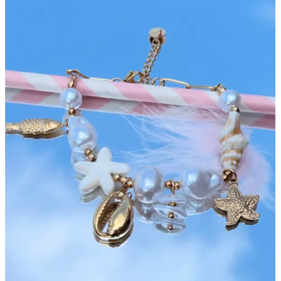 Bracelet Maïna en acier inoxydable doré – Bracelet charms coquillage, poisson et étoile de mer | My Poupi